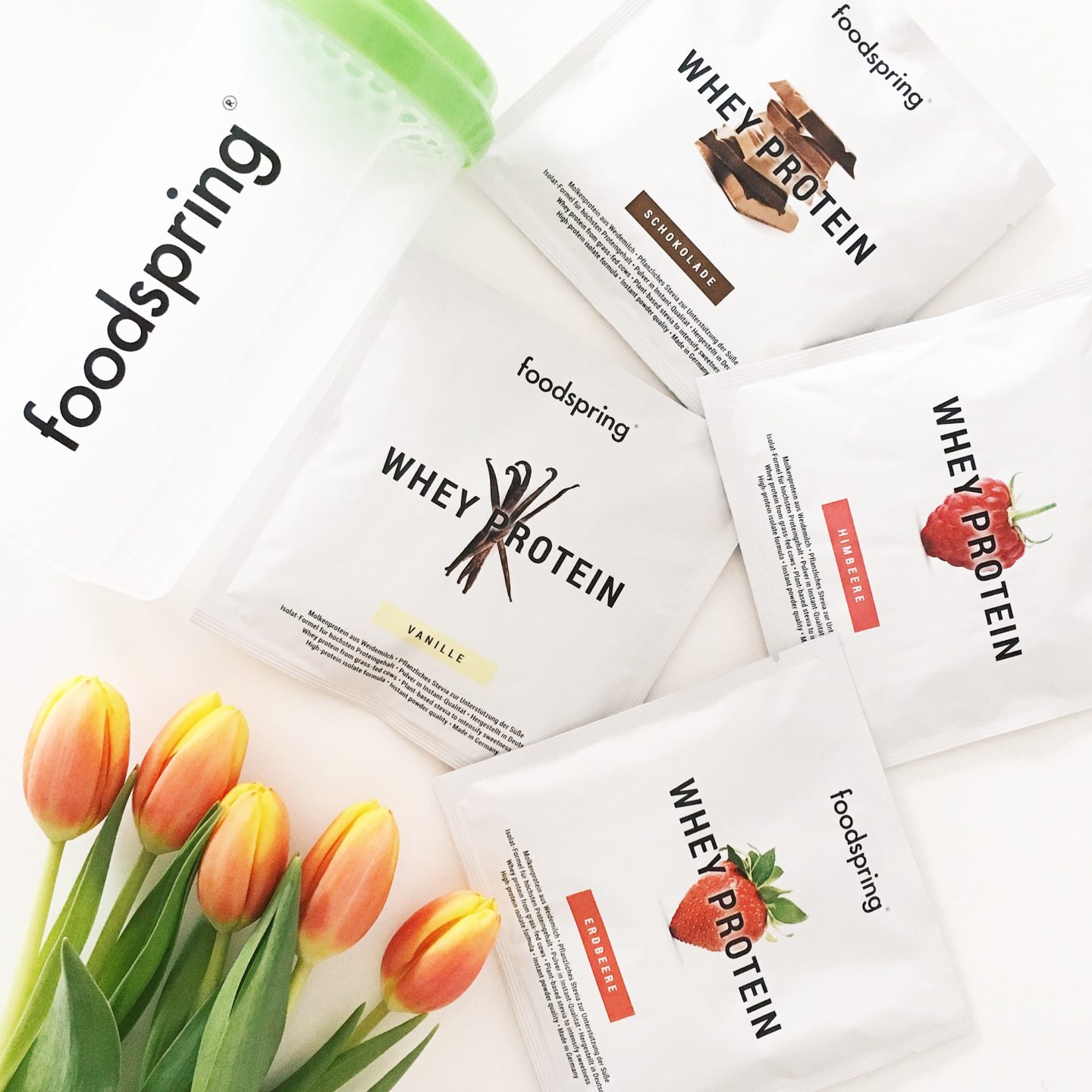 foodspring testpakete, ein foodspring shaker und tulpen